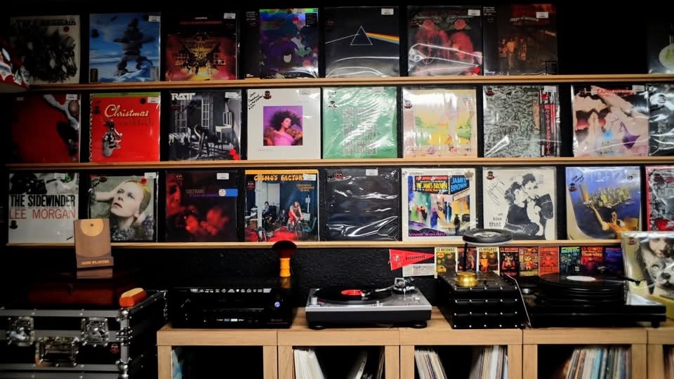 Inside CS Recordz — wall-to-wall vinyl albums, turntables, and a listening station